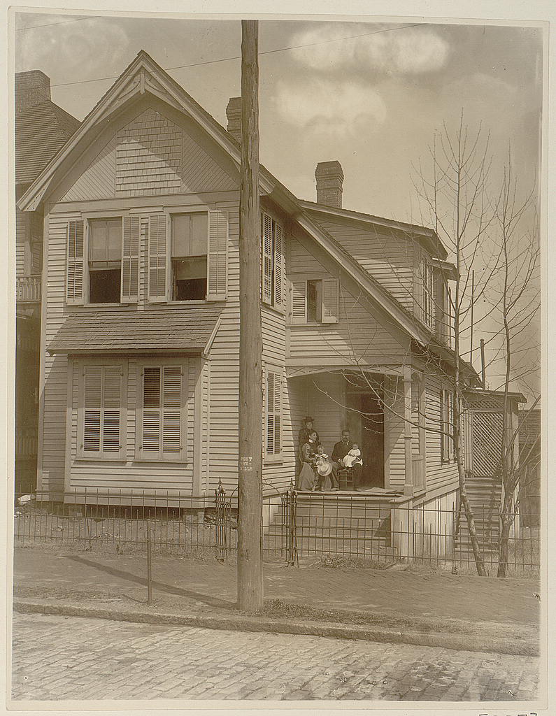[African American family posed on porch of house], 1899 (Library of Congress)