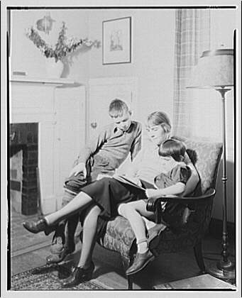 Art Brown and family. Brown family reading in chair I, 1937 (Library of Congress)