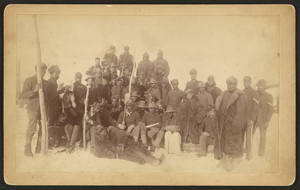 [Buffalo soldiers of the 25th Infantry, some wearing buffalo robes, Ft. Keogh, Montana], 1890 (Library of Congress)