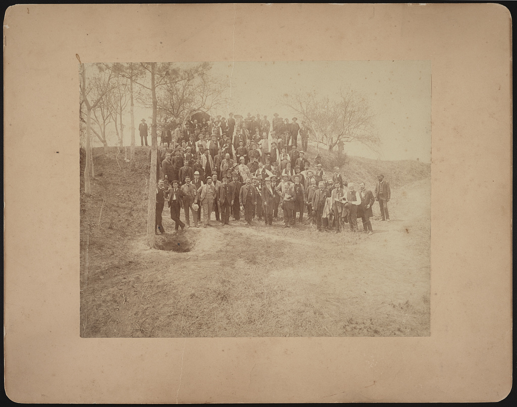 [Civil War veterans of the 57th Massachusetts Infantry Regiment with Confederate General William Mahone at the crater caused by Union soldiers exploding a mine at Petersburg, Virginia], 1887 (Library of Congress)