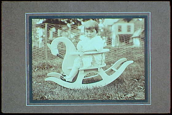Early years, with images of family, self portraits, landscapes and architectural interiors. Child on rocking bird, 1912 (Library of Congress)