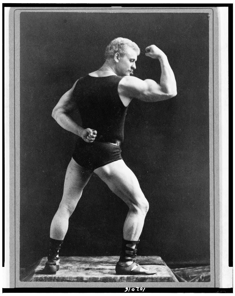 [Eugen Sandow, full-length portrait, standing, facing right, rear view, displaying arm muscles], 1893 (Library of Congress)
