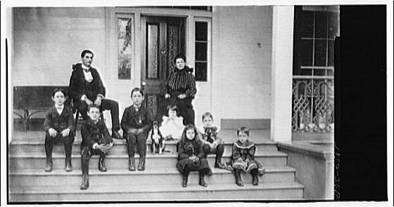 Family group with dog on porch, 1920 (Library of Congress)