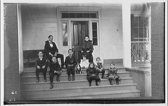 Family group with dog on porch, 1920 (Library of Congress)