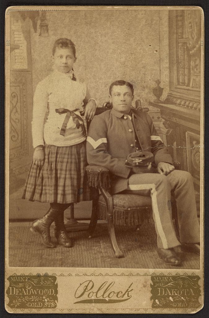 [Infantry sergeant, Buffalo soldier, with young girl], 1877 (Library of Congress)