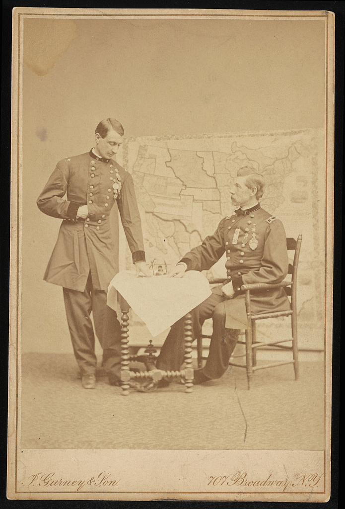 [Major General Alexander Shaler of U.S. Volunteers Infantry Regiment, 7th New York Infantry Regiment, and 65th New York Infantry Regiment in uniform, seated, looking at map on a table with unidentifie, 1861 (Library of Congress)