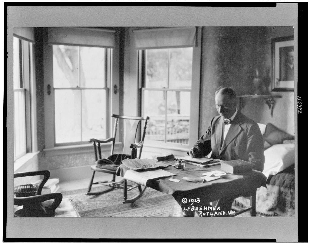 [President Calvin Coolidge, half-length portrait, seated at desk in family home in Rutland, Vt.], 1923 (Library of Congress)