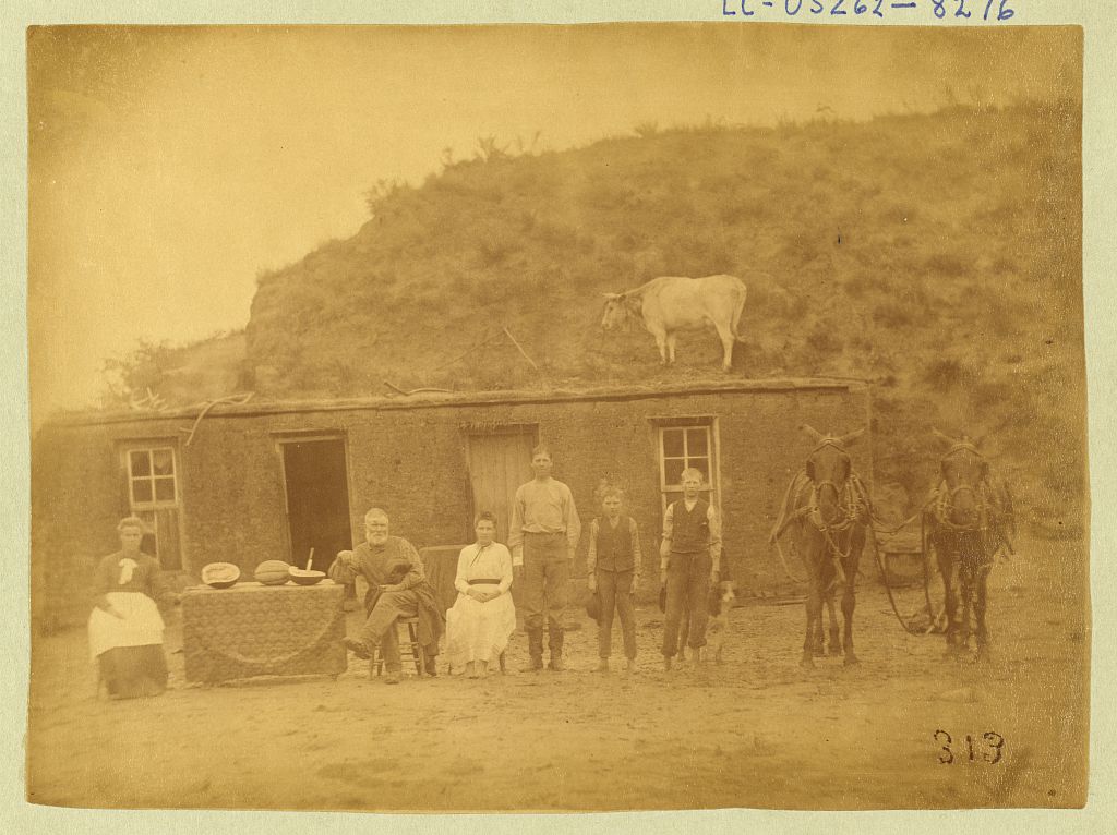 [Sylvester Rawding family in front of sod house, north of Sargent, Custer County, Nebraska], 1886 (Library of Congress)
