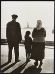 The Statue of Liberty from Ellis Island, U.S. immigration station in New York Harbor, a small boy shows his parents the Statue of Liberty, 1930 (Library of Congress)