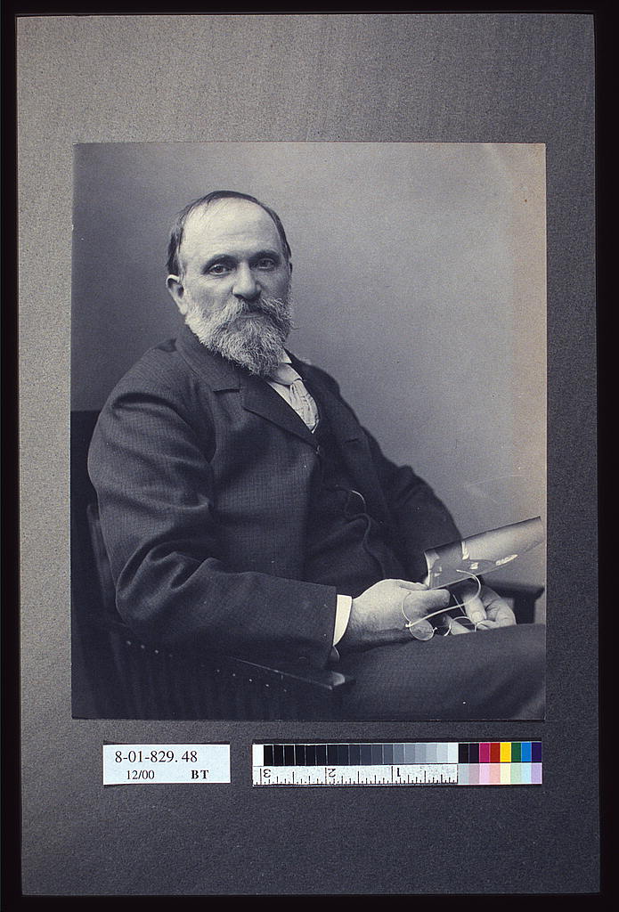 [Thomas Hovenden, artist, seated, holding a photograph(?), facing front, 1895 (Library of Congress)