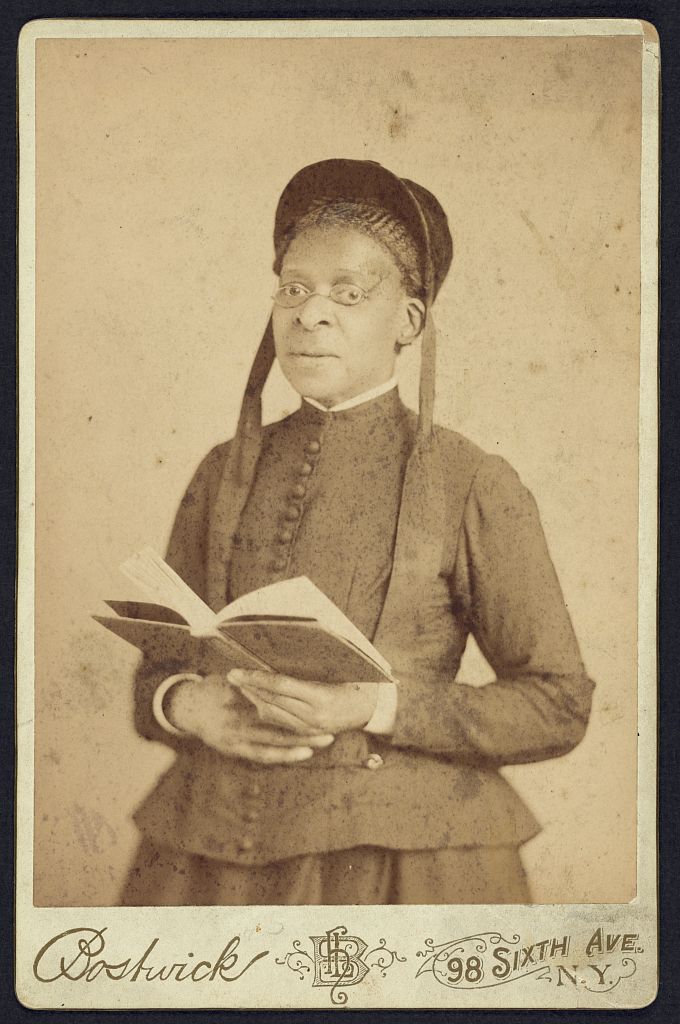 [Three-quarter length portrait of an African American woman posed with book], 1880 (Library of Congress)